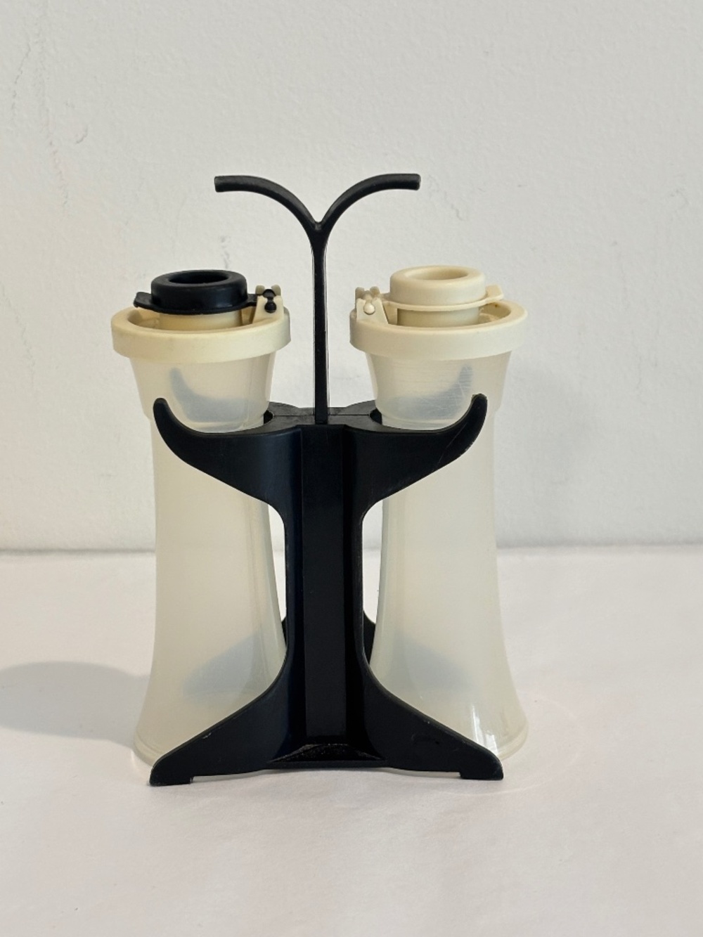 Vintage Tupperware salt & pepper shakers in caddy hourglass shaped small size